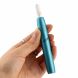 A blue IQOS device with a HEETS stick installed held in hand