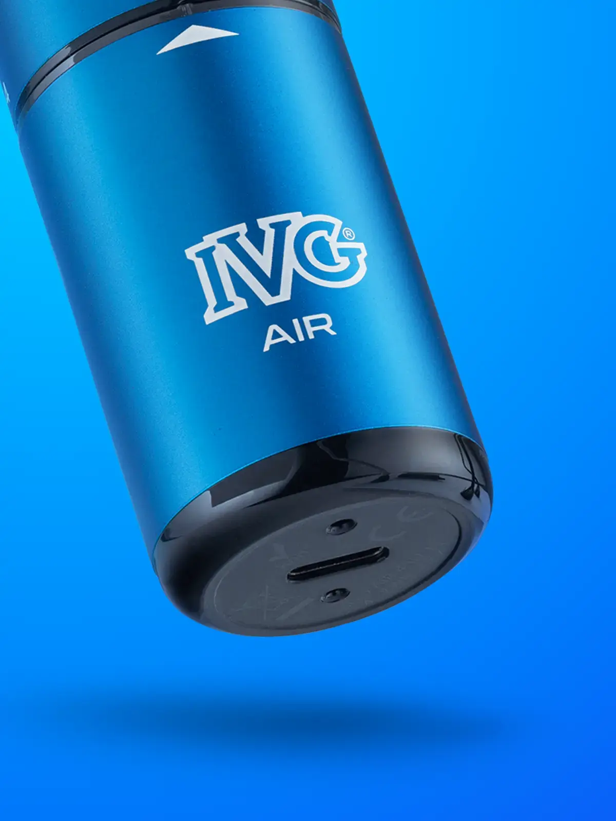 A Blue Edition IVG Air 4-in-1 disposable vape, close-up of the device showing the underside USB type-c port for re-charging. Floating in front of a blue background.