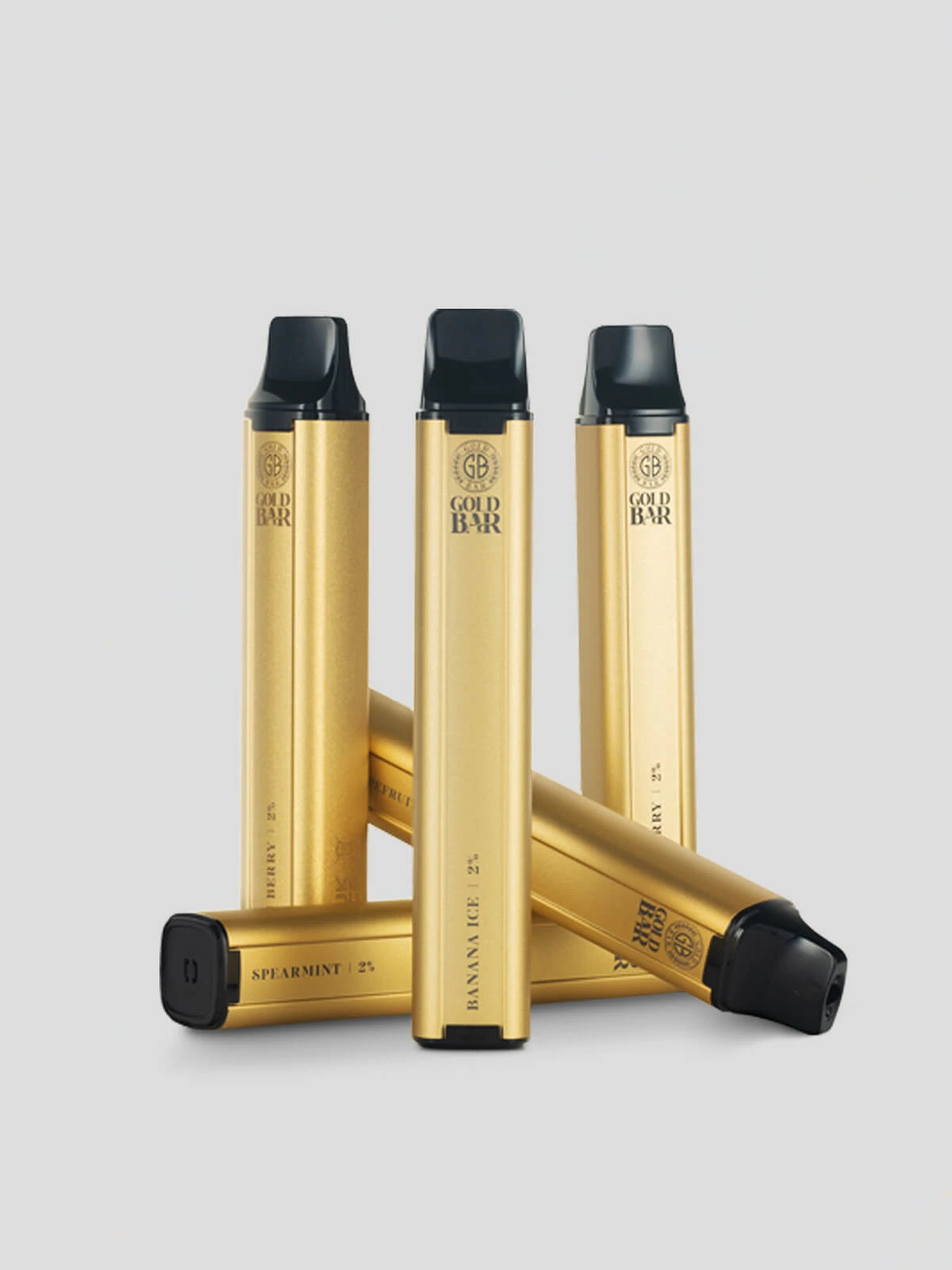 A collection of four Gold Bar disposables in front of a light background
