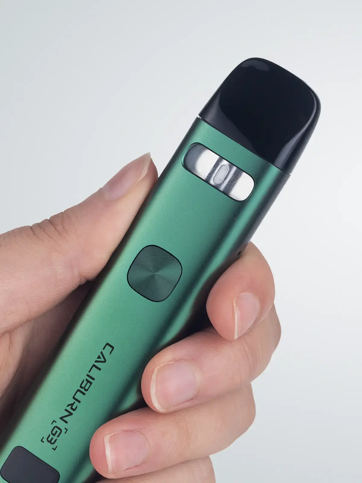 UWELL Caliburn G3 in Green, shown in-hand in front of a light background.