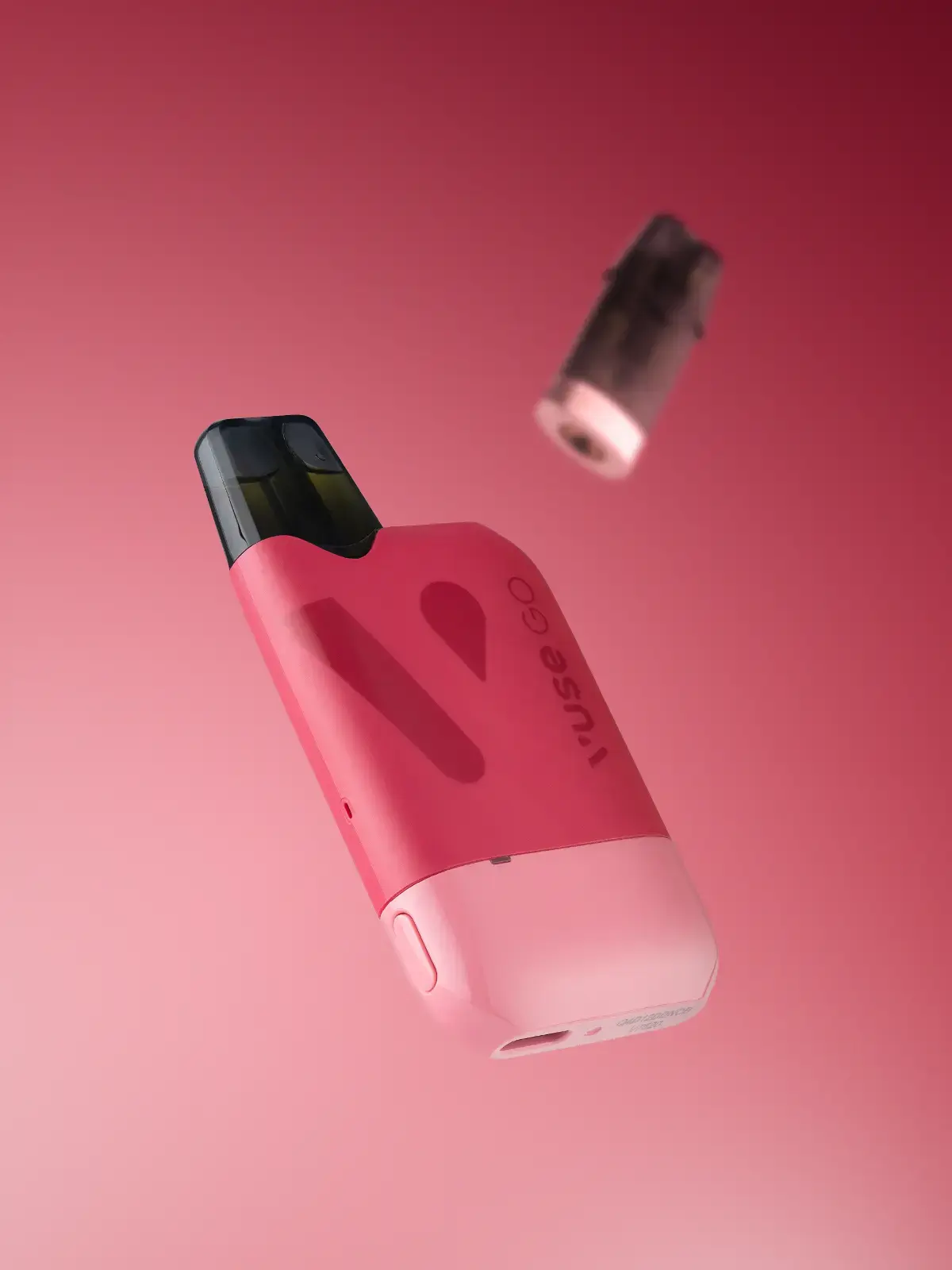 A Red VUSE Go Reload 1000 vape device, floating in front of a light red background along with a slightly blurred pod in the distance.