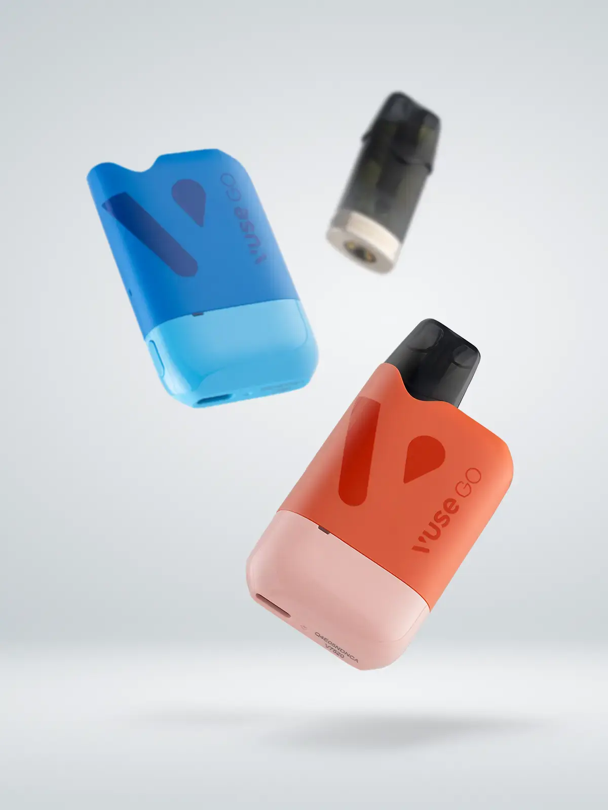 Two VUSE Go Reload 1000 kits; one in Blue with its pod out, and one in Orange with its pod in, along with a blurred pod in the background, floating in front of a bright background.