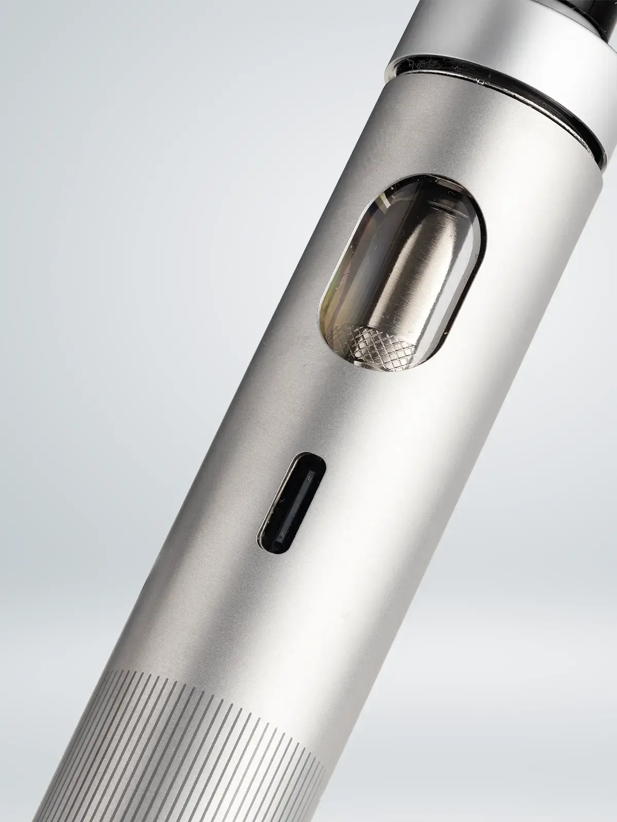 A zoomed-in photo of the Joyetech eGo AIO 2 in Silver showing its e-liquid viewing window and usb type-c charging port.