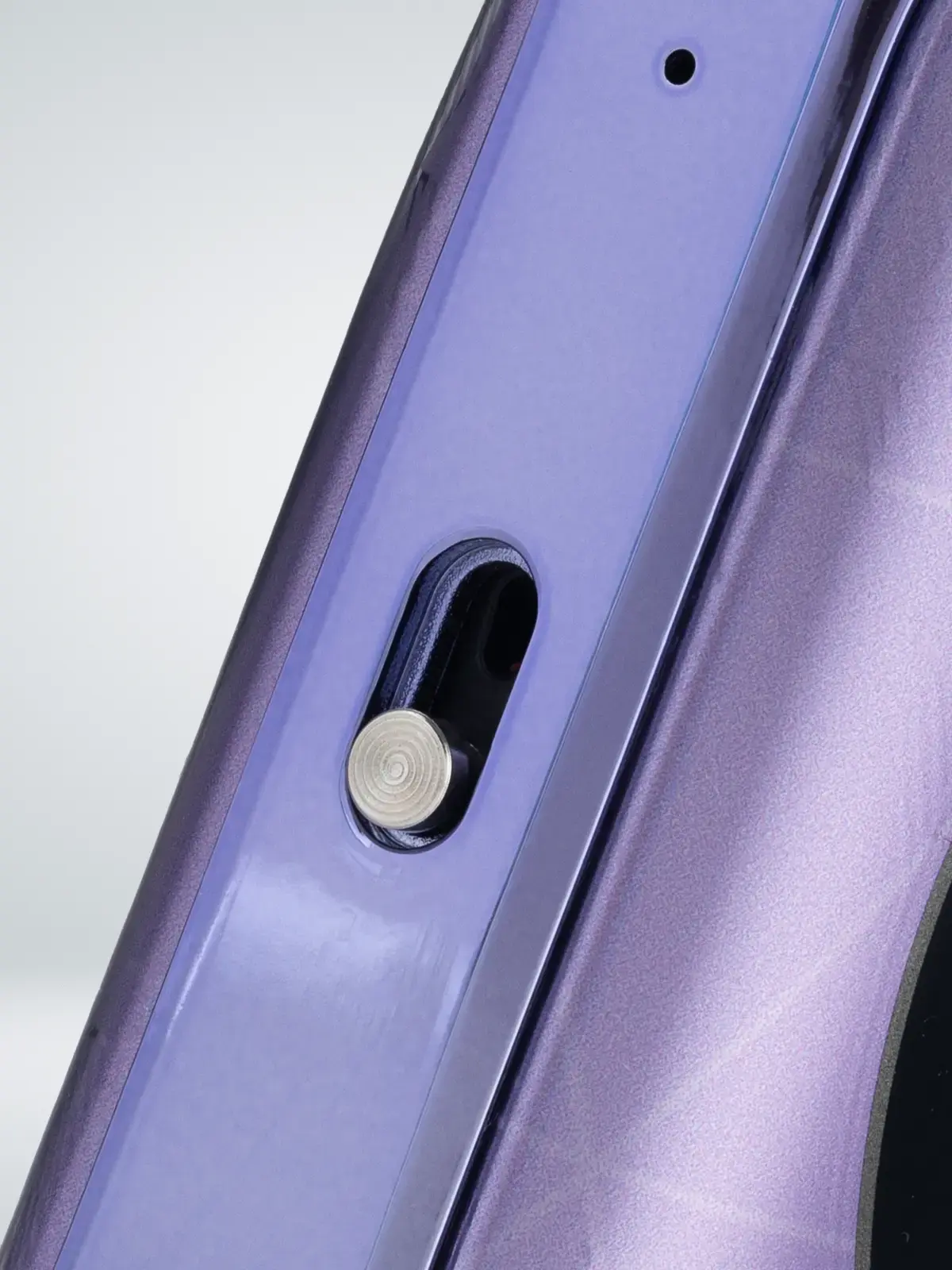 Vaporesso XROS 4 Nano device in Twilight Purple colour, close-up shot showing the airflow control.