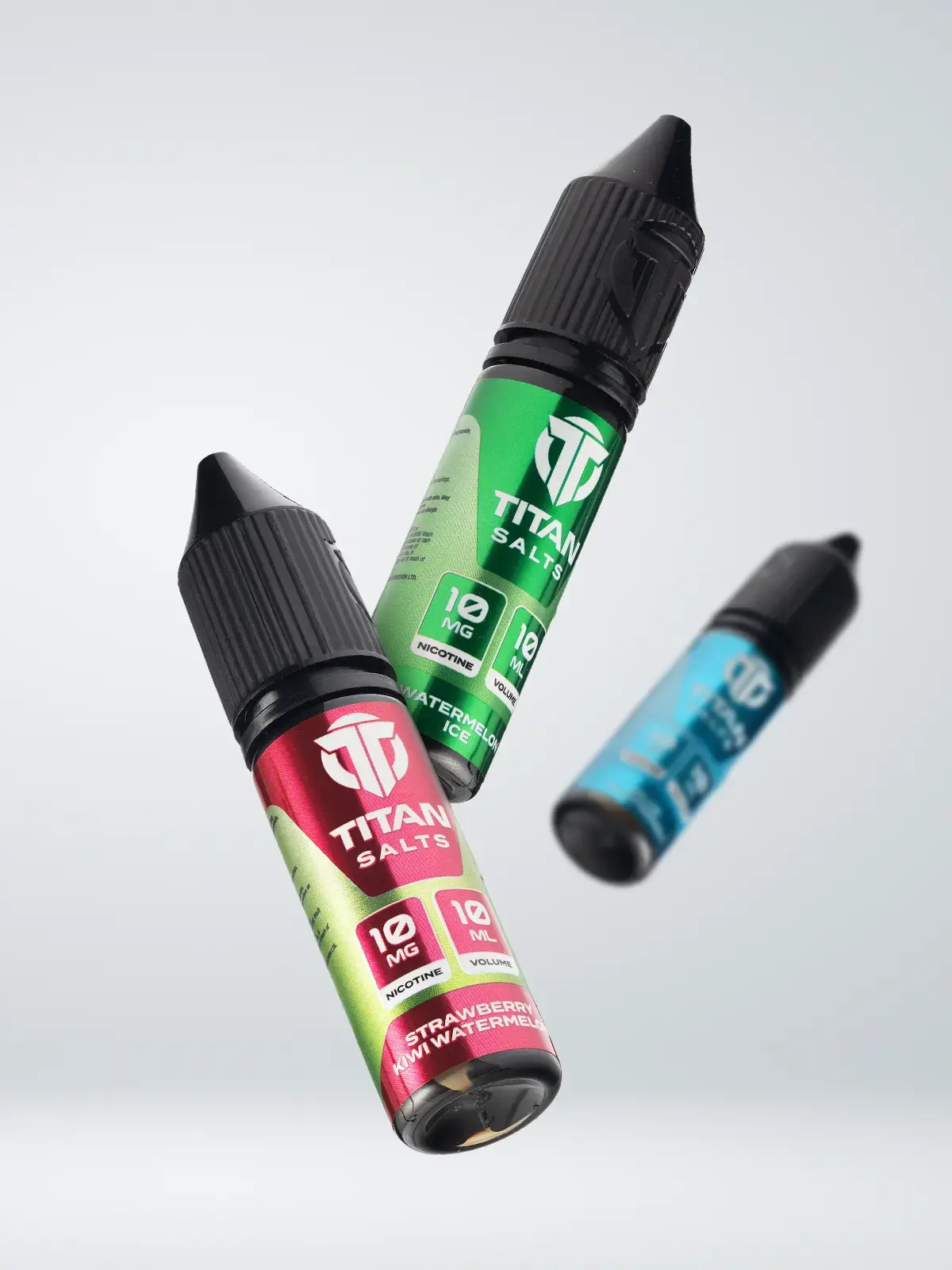 Three titan salts e-liquid bottles floating in front of a light background; Strawberry Kiwi Watermelon, Watermelon Ice and Blue Raspberry