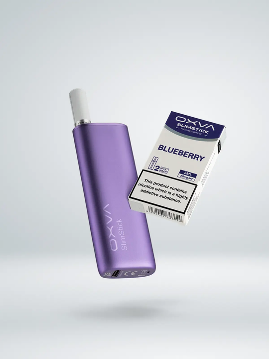 A purple OXVA Slim Stick kit floating next to a pack of Blueberry Slim Stick pods on a white background.