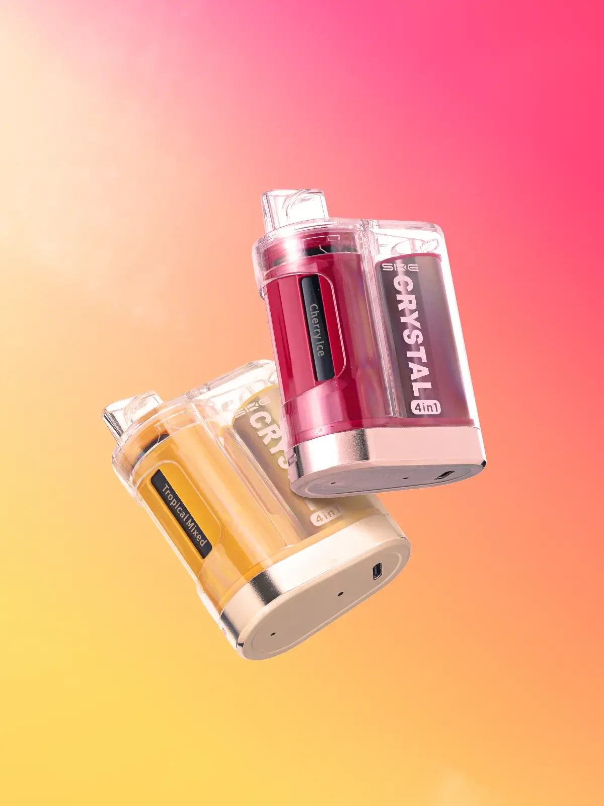 Two Crystal 4 in 1 devices; Tropical Mixed and Cherry Ice, floating in front of a yellow and pink background