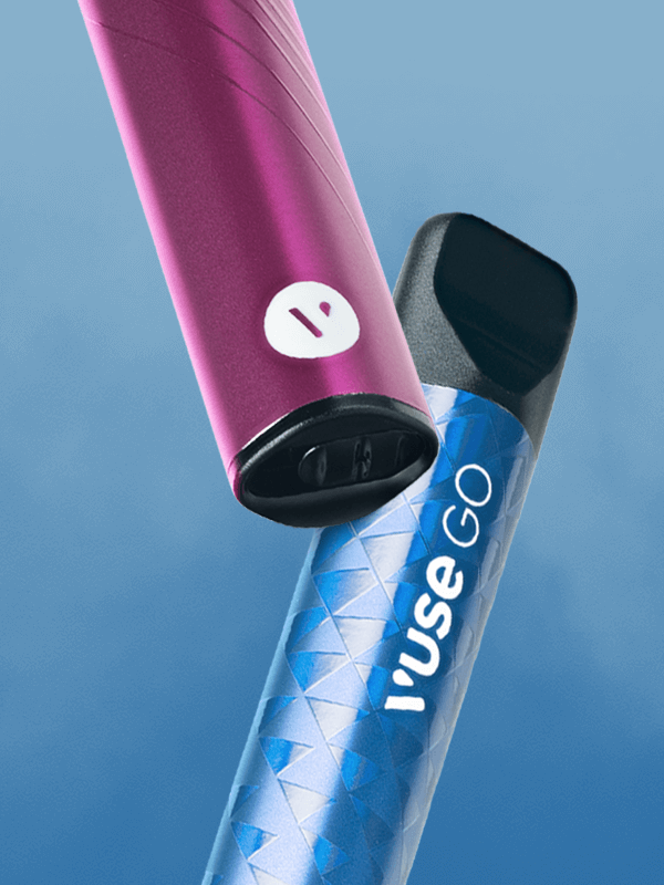 a close up of two floating VUSE Go disposable vapes