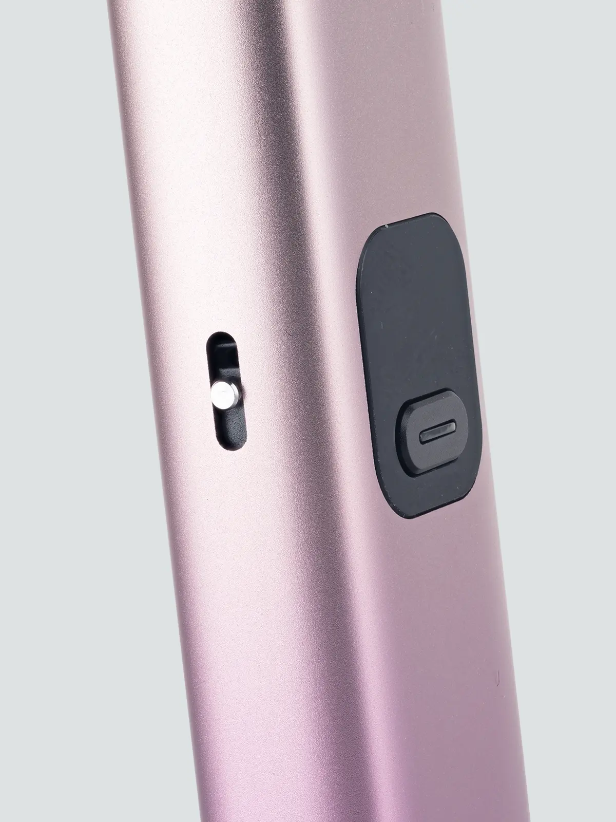 Innokin Trine device in Pink, angled to show its airflow control